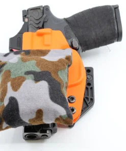 Cloudster Pillow Camo Deluxe holster wedge in front of an IWB holster