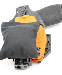 Cloudster Pillow Dark Deluxe holster wedge in front of an IWB holster