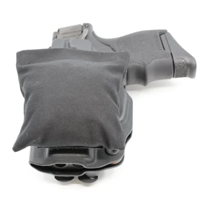Cloudster Pillow Dark Standard holster wedge in front of an IWB holster