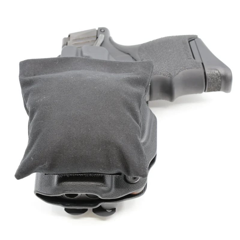 Cloudster Pillow Dark Standard holster wedge in front of an IWB holster