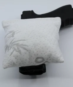 Cloudster Pillow White Monster holster wedge in front of an IWB holster