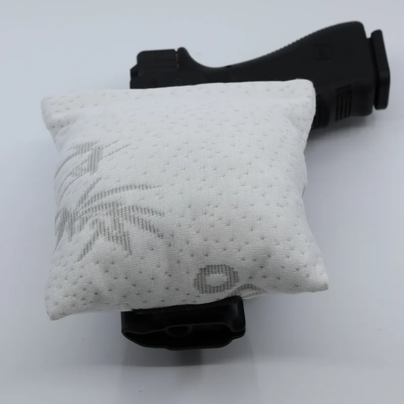 Cloudster Pillow White Monster holster wedge in front of an IWB holster