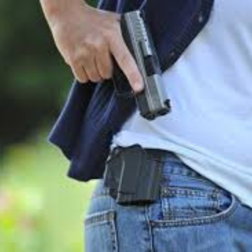 Gun in waistband, no Pillow holster visible.