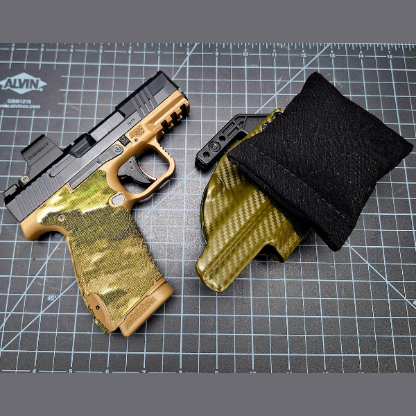 1. Custom Cloudster Pillow holster with camouflage design for secure firearm carry.