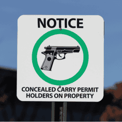 Notice sign for concealed carry permit holders on property.