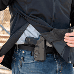 Holster worn under clothing for discreet concealment and easy access.