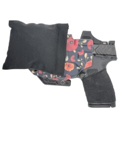 Cloudster Pillow Dark Deluxe holster wedge with a red floral Kydex holster and pistol