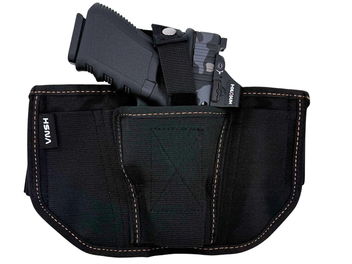 Glock 19 with a red-dot optic seated in a black bellyband holster