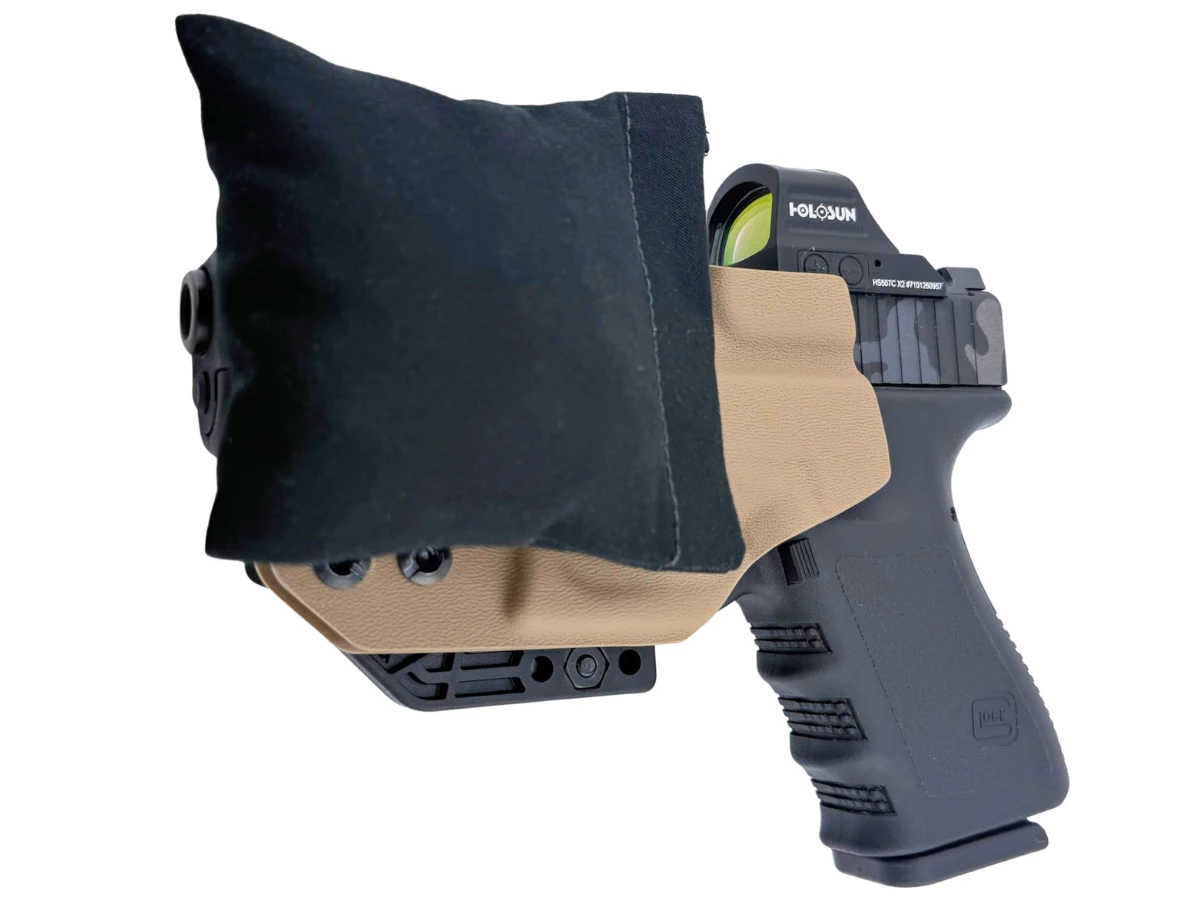 Close view of the Cloudster Pillow mounted on a Kydex holster, fabric and stitching visible