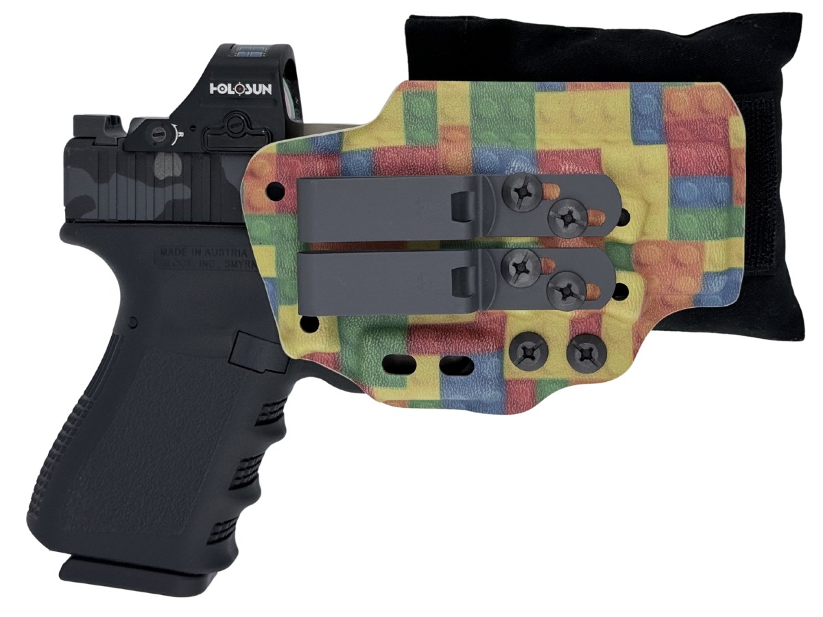 Cloudster Pillow with a custom Lego-pattern kydex holster and a pistol