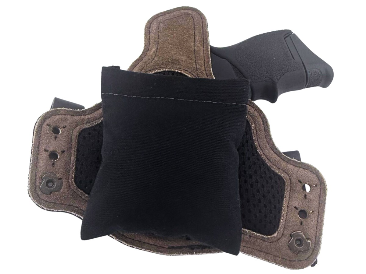 Cloudster Pillow with a brown leather hybrid holster and a pistol